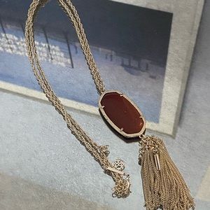 KENDRA SCOTT burnt orange tassel necklace.